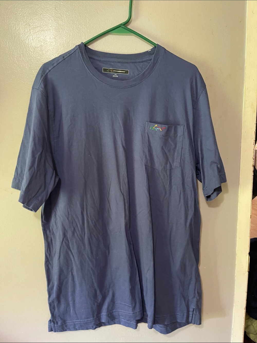 Greg Norman Collection Navy Pocket Tee with Multicolor Shark Accent